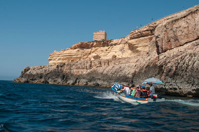 Boat in sea against clear sky