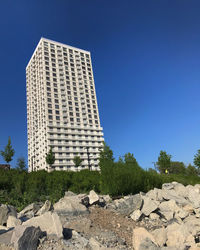 Low angle view of building against clear blue sky