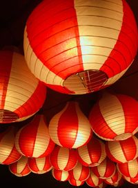 Low angle view of illuminated chinese lanterns hanging at night
