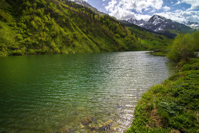 Scenic view of river and mountains