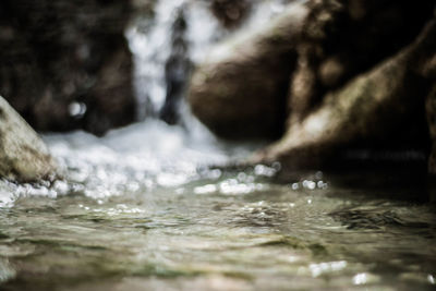 Close-up of water splashing on rocks