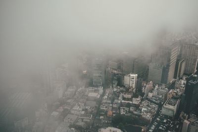High angle view of cityscape in foggy weather