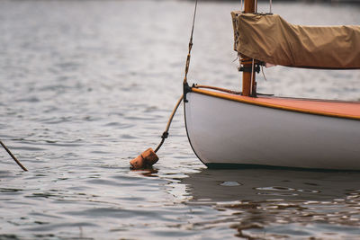 Sailboats moored in sea