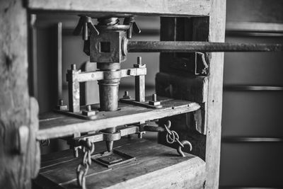 Close-up of machine part on table