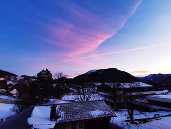 Scenic view of snowcapped mountains against sky during winter