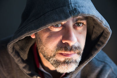 Bearded man wearing hood clothing