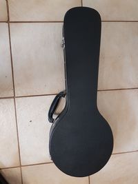 High angle view of guitar on tiled floor
