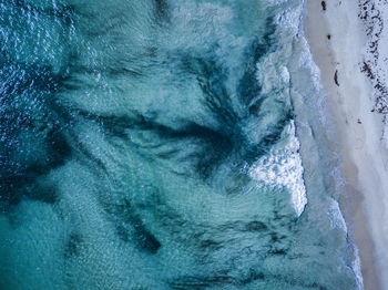 Close-up of sea waves in snow