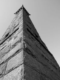 Low angle view of bird flying against clear sky