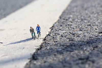 High angle view of people walking on road