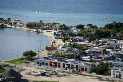 High angle view of cityscape by sea