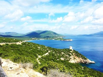 View of calm blue sea against cloudy sky