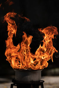 Close-up of fire burning at night