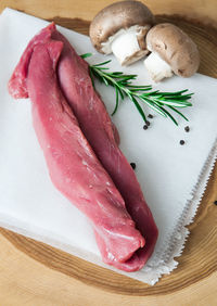 Close-up of meat on cutting board