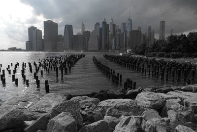 Panoramic view of sea and buildings against sky