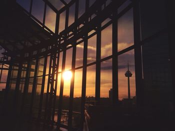 Silhouette of building at sunset