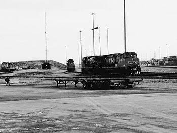 Cars on city against clear sky