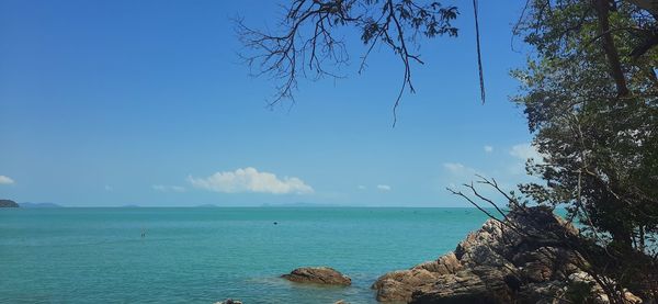 Scenic view of sea against blue sky