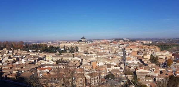 High angle shot of townscape against clear blue sky