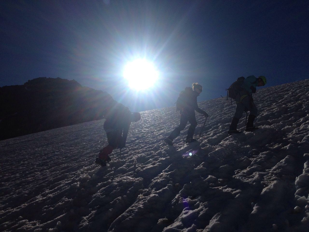 leisure activity, lifestyles, men, sun, sunlight, sunbeam, lens flare, full length, person, winter, silhouette, snow, mountain, togetherness, cold temperature, sunny, walking