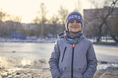 Portrait of smiling boy in snow