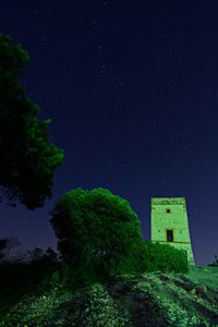 Low angle view of building against sky at night