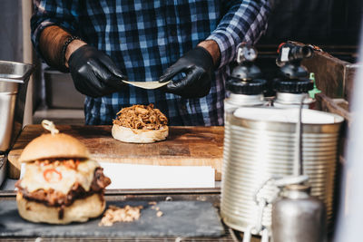 Midsection of man preparing food on table