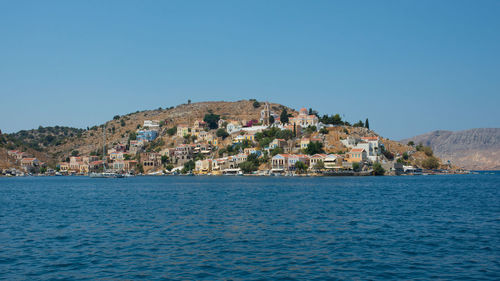 Beautiful view from the water of colorful symi island in summer. dodecanese, greece