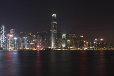 Illuminated buildings in city at night