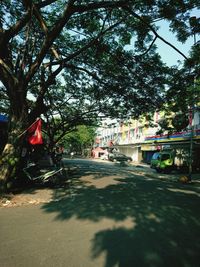 Street amidst trees and buildings in city