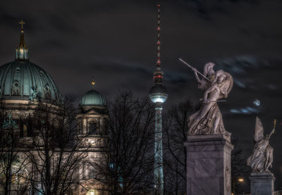 Illuminated cathedral against sky at night