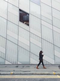 Full length of woman standing in city