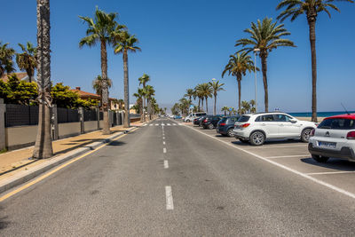 Cars on road against sky