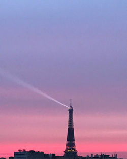 Tower of building against sky during sunset