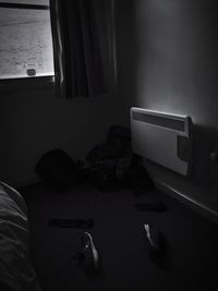 Low section of shoes on bed at home