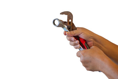 Midsection of person holding hands against white background