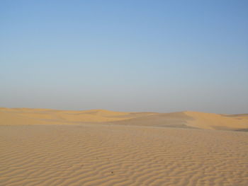 Scenic view of desert against clear sky