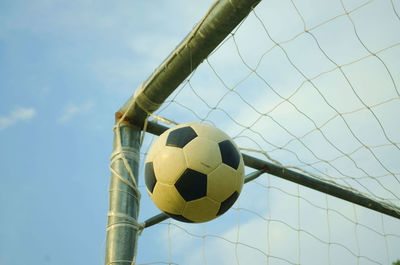 Low angle view of soccer ball against sky