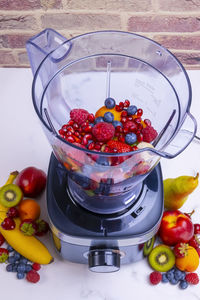 High angle view of strawberries in bowl on table