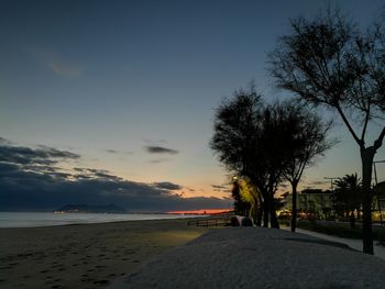 Scenic view of beach against sky during sunset