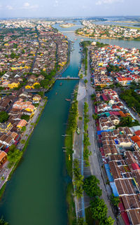 High angle view of river amidst buildings in city