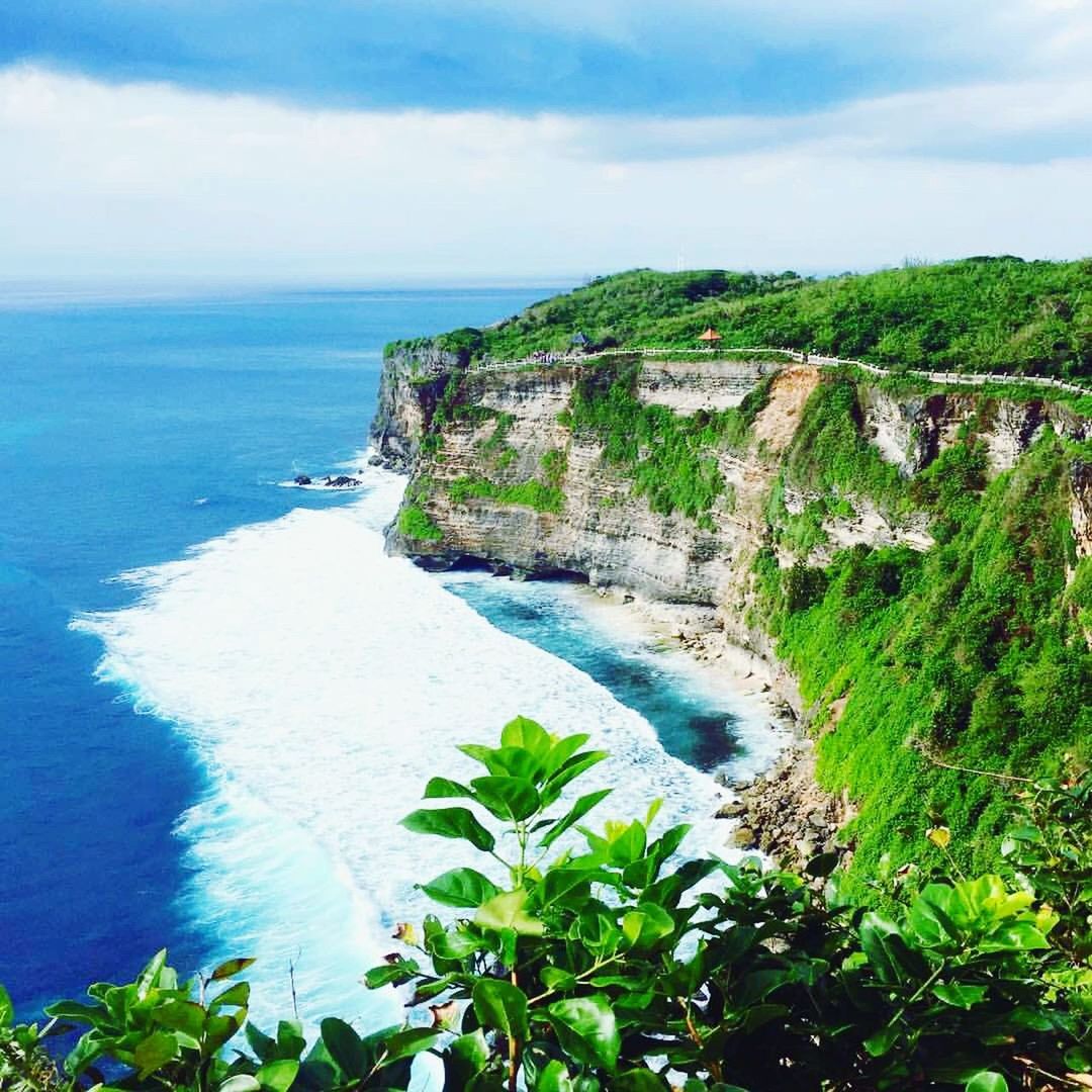 SCENIC VIEW OF SEA AND CLIFF AGAINST SKY