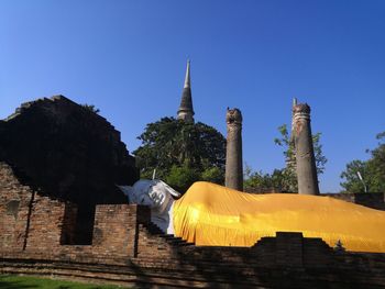 Ancient buildings and buddha images with blue skies.