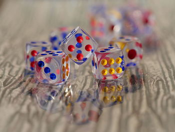 Close-up of multi colored dice on table