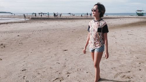 Woman standing on beach