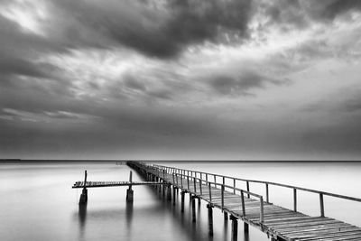 Scenic view of sea against storm clouds