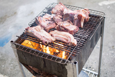 High angle view of meat on barbecue grill