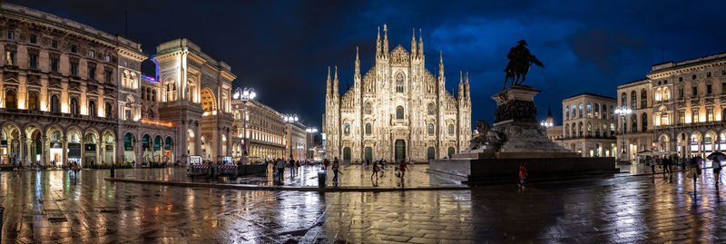 Reflection of illuminated buildings in city at night