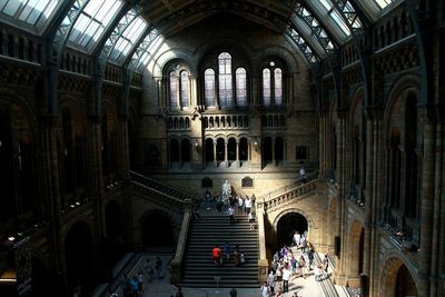 Group of people walking in museum