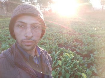 Portrait of young man against trees